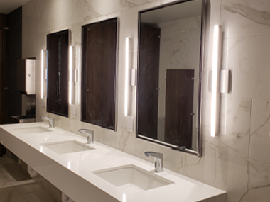 Kuzco-Vega fixtures installed in the restrooms.