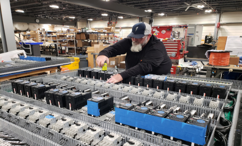 "Advanced factory machinery integrated into commercial operations by skilled technicians."