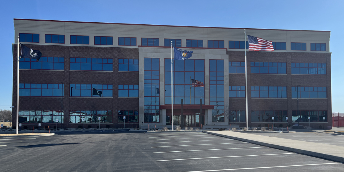 Outside of building with flags in front of it