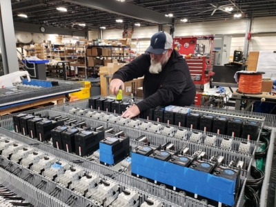 "Advanced factory machinery integrated into commercial operations by skilled technicians."